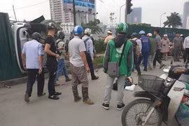 Một nạn nhân vụ xe điên nằm tại hiện trường (Ảnh: Beatvn) 