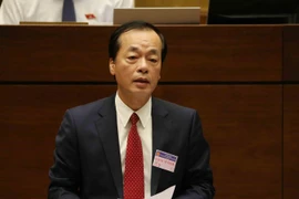 Bộ trưởng Bộ Xây dựng Phạm Hồng Hà trả lời chất vấn của đại biểu Quốc hội. (Ảnh: Phương Hoa/TTXVN)