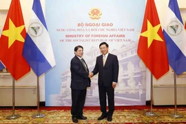 Phó Thủ tướng, Bộ trưởng Bộ Ngoại giao Phạm Bình Minh với Bộ trưởng Ngoại giao và Tôn giáo nước Cộng hòa Nicaragua Denis Ronaldo Moncada Colindres. (Ảnh: Văn Điệp/TTXVN)