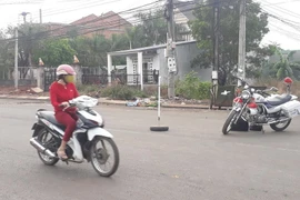 Hiện trường nơi phát hiện thi thể người phụ nữ. (Ảnh: Đậu Tất Thành/TTXVN)