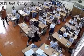 Cô giáo đánh học sinh (ảnh cắt từ clip)