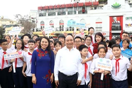 Thủ tướng Nguyễn Xuân Phúc dự Lễ phát động Năm an toàn cho phụ nữ và trẻ em. (Ảnh: Thống Nhất/TTXVN)