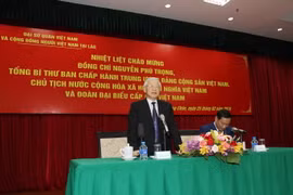 Tổng Bí thư, Chủ tịch nước Nguyễn Phú Trọng đến thăm, nói chuyện với cán bộ, nhân viên Đại sứ quán, đại diện cộng đồng, lưu học sinh và doanh ngiệp Việt Nam tại Lào. (Ảnh: Trí Dũng/TTXVN)