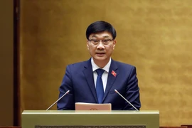 Ủy viên Ủy ban Thường vụ Quốc hội, Chủ nhiệm Ủy ban Kinh tế của Quốc hội Vũ Hồng Thanh trình bày Báo cáo giải trình, tiếp thu, chỉnh lý dự thảo Luật Đất đai (sửa đổi). (Ảnh: Phạm Kiên/TTXVN)