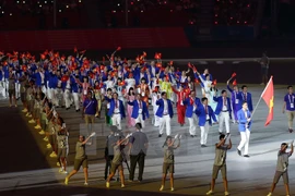 Đoàn Việt Nam trong lễ khai mạc. (Ảnh: Quốc Khánh/TTXVN)