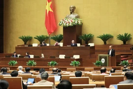 Phó Thủ tướng Thường trực Trương Hòa Bình tình bày báo cáo của Chính phủ về công tác phòng ngừa, chống tội phạm và vi phạm pháp luật; công tác thi hành án và công tác phòng, chống tham nhũng năm 2020. (Ảnh: Lâm Khánh/TTXVN)