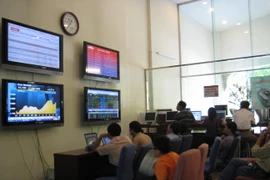 Để giảm tải đầu mối báo cáo, công bố thông tin, Ủy ban Chứng khoán Nhà nước đã triển khai các giải pháp công nghệ đồng bộ các yêu cầu về nghiệp vụ. (Ảnh: Vietnam+)