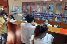 Công tác quản lý nợ thuế trong bối cảnh nền kinh tế khó khăn đang gặp nhiều thách thức, kể cả trong công tác phối hợp với các cơ quan ban, ngành có liên quan trên địa bàn. (Ảnh: Vietnam+)