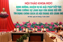 Hội thảo khoa học “Định hướng, nhiệm vụ và giải pháp tiếp tục tăng cường sự lãnh đạo của Đảng đối với tín dụng chính sách xã hội trong bối cảnh mới mới,” ngày 2/7. (Ảnh: Vietnam+)