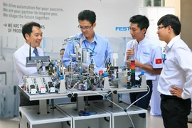 Tự động hóa sẽ giúp tăng năng suất lao động. (Ảnh minh họa: Văn Việt/TTXVN)