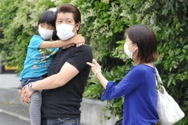 Số ca mắc mới COVID-19 cao nhất kể từ khi dịch bệnh này thuyên giảm vào tháng 5. (Ảnh: AFP/TTXVN)