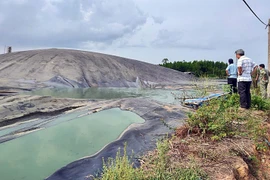 Khu vực hồ chứa biogas nơi 2 người tử vong. (Nguồn: Báo Công an Nhân dân)