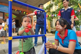 Ngày hội tạo nên sân chơi bổ ích giúp các em có khuyết tật trí tuệ, khuyết tật phát triển được thể hiện và phát huy tối đa khả năng của mình. (Ảnh: Mai Trang/TTXVN)