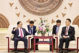 Thủ tướng Phạm Minh Chính tiếp ông Lưu Ninh, Bí thư Khu ủy Khu tự trị dân tộc Choang Quảng Tây, Trung Quốc. (Ảnh: Dương Giang/TTXVN)