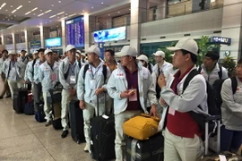 Tốp lao động Việt Nam đầu tiên thuộc diện áp dụng MOU đặc biệt tái nhập cảnh Hàn Quốc. (Ảnh: Phạm Duy/Vietnam+)