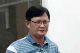 Bị can Huỳnh Hồng Bảo tại thời điểm bị bắt. (Ảnh: TTXVN phát)