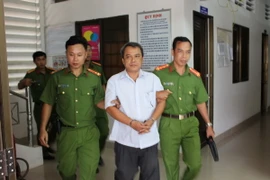 Ông Lê Văn Hồng Anh bị bắt tại nơi làm việc. (Ảnh: Thanh Hòa/TTXVN)