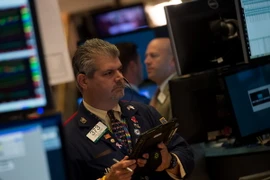 Giao dịch viên tại Sàn giao dịch chứng khoán New York, Mỹ (Nguồn: AFP/TTXVN)