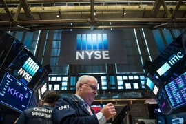 Giao dịch viên tại Sàn giao dịch chứng khoán New York, Mỹ (Nguồn: AFP/TTXVN)