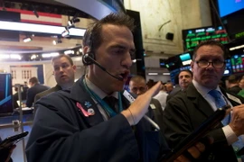 Giao dịch viên tại Sàn giao dịch chứng khoán New York, Mỹ. (Nguồn: AFP/TTXVN)