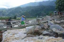 Sau lũ, nhiều khu vực tại huyện Trạm Tấu tan hoang chỉ còn bùn đất ngổn ngang. (Ảnh: Tuấn Anh/TTXVN)