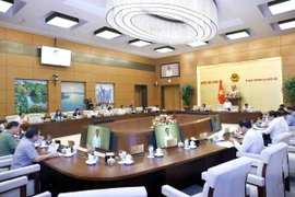 Ủy viên Ban Thường vụ Quốc hội cho ý kiến về hai dự thảo Luật Phòng, chống mua bán người (sửa đổi) và Luật Công chứng (sửa đổi). (Ảnh: Doãn Tấn/TTXVN)