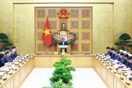 Thủ tướng Phạm Minh Chính tọa đàm với các doanh nghiệp Trung Quốc tiêu biểu trong lĩnh vực phát triển kinh tế xanh, kinh tế số. (Ảnh: Dương Giang/TTXVN)