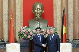 Chủ tịch nước Tô Lâm tiếp Chủ tịch Chính hiệp Trung Quốc Vương Hộ Ninh. (Ảnh: Nhan Sáng/TTXVN)