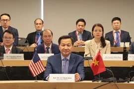 Phó Thủ tướng Chính phủ Lê Minh Khái trao đổi trực tuyến với Đại diện Thương mại Hoa Kỳ Katherine Tai. (Ảnh: Thanh Tuấn/TTXVN)