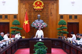 Thủ tướng Phạm Minh Chính chủ trì làm việc với các bộ, ngành, địa phương để đẩy nhanh tiến độ hoàn thành Dự án đường dây tải điện 500kV mạch 3. (Ảnh: Dương Giang/TTXVN)