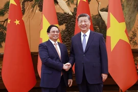 Thủ tướng Phạm Minh Chính hội kiến Tổng Bí thư, Chủ tịch nước Trung Quốc Tập Cận Bình. (Ảnh: Dương Giang/TTXVN)