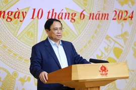 Thủ tướng Phạm Minh Chính chủ trì Hội nghị sơ kết 01 năm thực hiện tháo gỡ vướng mắc thực hiện Đề án 06. (Ảnh: Dương Giang/TTXVN)