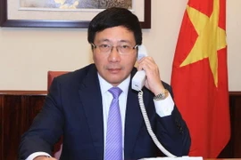 Phó Thủ tướng, Bộ trưởng Ngoại giao Phạm Bình Minh điện đàm với Ngoại trưởng Hoa Kỳ John Kerry. (Nguồn: Vietnam+)