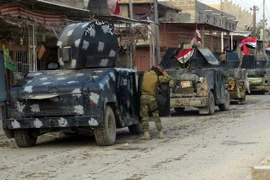 Lực lượng ủng hộ Chính phủ Iraq sau các cuộc giao tranh tại thành phố Ramadi, tỉnh Anbar ngày 1/1/2016. (Nguồn: AFP/TTXVN)