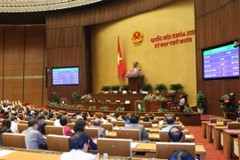Quốc hội biểu quyết thông qua Ngày bầu cử. (Ảnh: Phương Hoa/TTXVN)