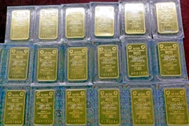 Vàng miếng SJC. (Ảnh: Trần Việt/TTXVN)