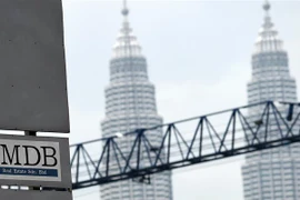 Logo Quỹ 1MDB tại điểm giao dịch ngoại hối Tun Razak ở Kuala Lumpur ngày 8/7/2015. (Ảnh: AFP/TTXVN)