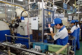 Hoạt động sản xuất tại khu công nghiệp Khai Quang, Vĩnh Phúc. (Ảnh: Danh Lam/TTXVN)