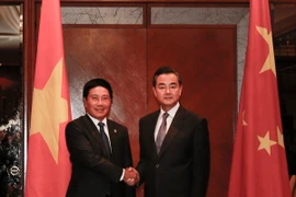 Phó Thủ tướng Phạm Bình Minh và Bộ trưởng Ngoại giao Trung Quốc Vương Nghị tại cuộc gặp song phương. (Ảnh: Kim Dung-Chí Giáp/Vietnam+)