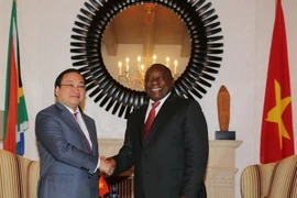 Phó Thủ tướng Hoàng Trung Hải gặp và làm việc với Phó Tổng thống Nam Phi Cyril Ramaphosa. (Nguồn: TTXVN)