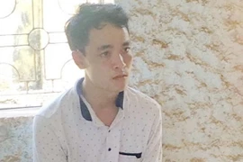 Đối tượng Hồ Chí Bảo tại cơ quan điều tra. (Ảnh: Hồ Cầu/TTXVN)