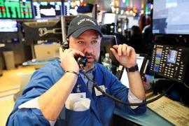 Giao dịch viên tại Sàn giao dịch chứng khoán New York, Mỹ. (Nguồn: THX/TTXVN)