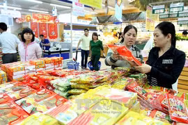 Mua sắm tại hệ thống Saigon Co.op. (Ảnh: Thanh Vũ/TTXVN)