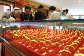 Vàng giảm sự hấp dẫn, phụ nữ Trung Quốc ồ ạt mua cổ phiếu