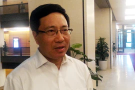 Phó Thủ tướng Chính phủ Phạm Bình Minh trả lời báo chí chiều 28/7. (Ảnh: T.H/Vietnam)