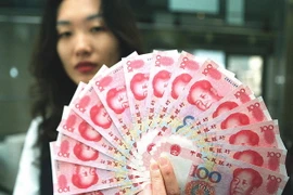 Đồng tiền Nhân dân tệ mệnh giá 100. (Nguồn: AFP/TTXVN)