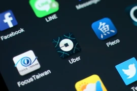 Biểu tượng của tập đoàn Uber trên màn hình điện thoại . (Nguồn: EPA/TTXVN)