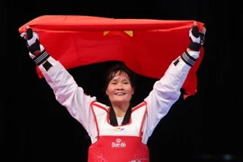 Niềm vui của VĐV Hà Thị Nguyên (Việt Nam) sau khi đoạt HCV nội dung đối kháng, hạng cân dưới 62kg nữ. (Ảnh: Quốc Khánh/TTXVN)