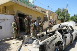 Lực lượng Iraq trong chiến dịch truy quét IS ở phía tây Mosul ngày 28/5. (Nguồn: THX/TTXVN)