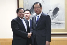 Bí thư Trung ương Đảng Phạm Minh Chính và Chủ tịch Đoàn Chủ tịch Ban Chấp hành Trung ương Đảng Cộng sản Nhật Bản Shii Kazuo.(Ảnh: Cẩm Tuyến/TTXVN)